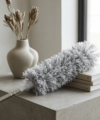Extendable and bendable grey microfiber duster for cleaning high ceilings and fans.