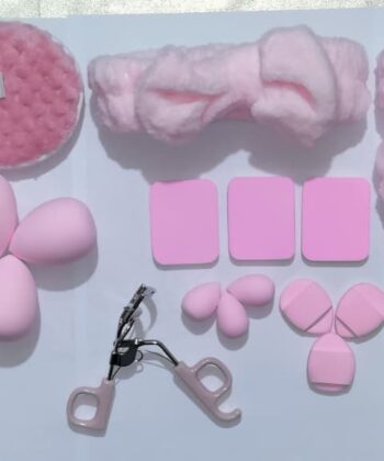 Multipurpose Travel Makeup Kit with Brushes Beauty Blenders Eyelash Curler and Accessories in Transparent Washbag.