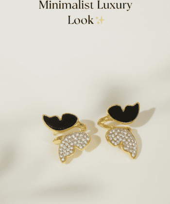 Close up of Zircon Butterfly Golden Stud Earrings with black enamel