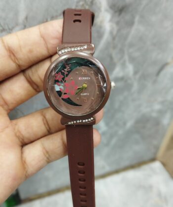 Curren Golden Princess floral watch with vibrant blue silicone strap and gold dial accents.