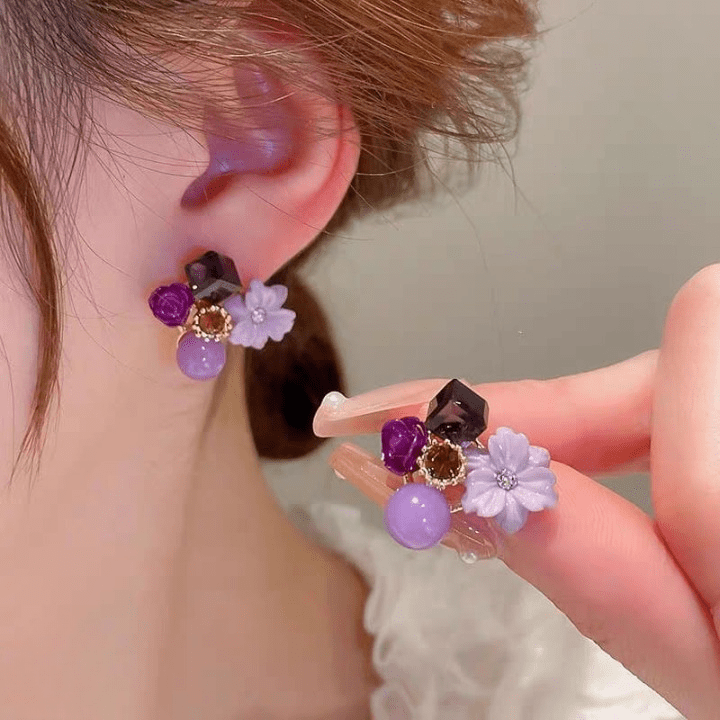 Korean-Floral-Crystal-Stud-Earrings-Aish-Splash Close up of a woman's ear wearing a pink floral crystal stud earring