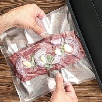 Electric vacuum sealing machine for preserving meat and vegetables.