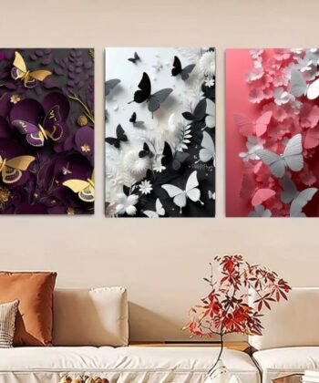 Set of 3 wall art tiles featuring intricate paper-cut style butterflies in purple, monochrome, and pink above a sofa.