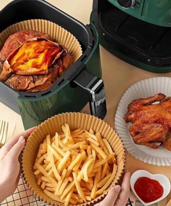 Pack of 50 Disposable Air Fryer Liners in use with fries and chicken.
