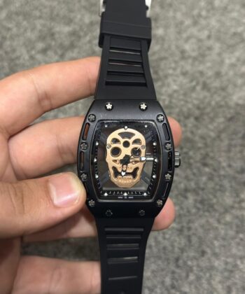 Skull skeleton matte sport watch featuring a black silicone strap and a luxury tonneau-shaped metal case.