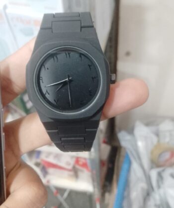 Full black minimalist analog watch with matte finish and integrated strap.