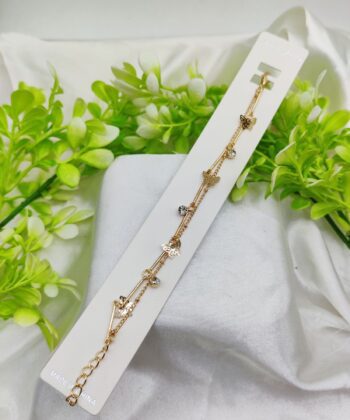 Gold-plated double-layer bracelet with floral charms and small crystals.