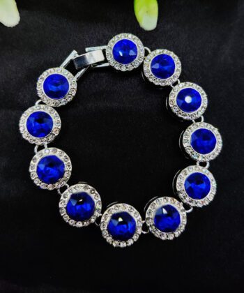 Silver-tone link bracelet with round ruby-red crystals and white crystal halos.