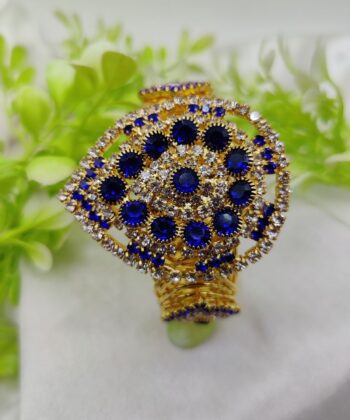 Heart-shaped gold-plated bracelet with dense crystal embellishments on a white background.