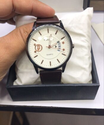 Black leather strap Police watch with white textured dial on wrist.