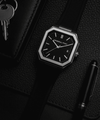Universal Point UP 1988 men's watch with square silver case and black leather strap.