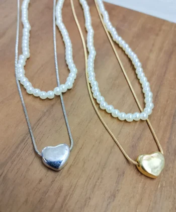 Stunning double layer pearl necklace with heart pendant for women.